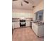Well-lit kitchen with stainless steel appliances and white cabinets, providing a clean and modern aesthetic at 107 Vista Verdi Cir # 237, Lake Mary, FL 32746