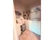 Practical laundry room equipped with a washer, dryer, storage shelves, and counter space for convenience at 107 Vista Verdi Cir # 237, Lake Mary, FL 32746