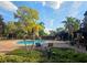Community pool surrounded by lounge chairs and lush landscaping at 107 Vista Verdi Cir # 237, Lake Mary, FL 32746