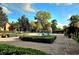 Community pool area with surrounding landscape at 107 Vista Verdi Cir # 237, Lake Mary, FL 32746