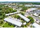Aerial view of white condos with lots of parking and landscaping, near a main street in the city at 1140 S Orlando Ave # E-1, Maitland, FL 32751
