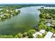 Aerial view of a lush neighborhood, showcasing a large lake and waterfront properties at 1140 S Orlando Ave # E-1, Maitland, FL 32751