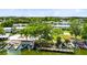 Scenic aerial view of waterfront condos with a community pool, docks, and lush greenery at 1140 S Orlando Ave # E-1, Maitland, FL 32751