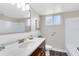 Bright bathroom features a new vanity, a shower, and wood-look flooring at 1140 S Orlando Ave # E-1, Maitland, FL 32751