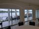 Bright community room with sliding glass doors showcasing picturesque lake views and access to outdoor seating at 1140 S Orlando Ave # E-1, Maitland, FL 32751