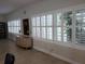 Well-lit community room with shuttered windows, display cabinet and stylish decor creating an inviting atmosphere at 1140 S Orlando Ave # E-1, Maitland, FL 32751