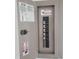 Open electrical panel showcasing labeled breakers and safety warnings, ensuring a safe electrical system at 1140 S Orlando Ave # E-1, Maitland, FL 32751