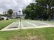 Multiple shuffleboard courts amidst lush landscaping, offering a fun recreational amenity for residents at 1140 S Orlando Ave # E-1, Maitland, FL 32751