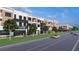 Charming street view featuring commercial buildings, well-manicured landscaping, and convenient street parking at 1250 Water Maple Dr, Oakland, FL 34787