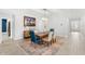 Elegant dining room with stylish lighting, modern decor, and a doorway to another room at 132 Rosa Bella Vw, Debary, FL 32713