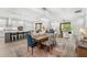 Open-concept dining area with a view of the modern kitchen and living space at 132 Rosa Bella Vw, Debary, FL 32713