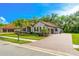 Charming single-Gathering home with a well-maintained yard, a brick-paved driveway, and mature landscaping at 132 Rosa Bella Vw, Debary, FL 32713