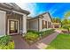 Close-up view of the front of home, showcasing well manicured landscaping and tile roof at 132 Rosa Bella Vw, Debary, FL 32713