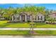 Charming single-story home featuring a well-manicured lawn and beautiful landscaping, offering great curb appeal at 132 Rosa Bella Vw, Debary, FL 32713