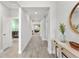 Bright hallway with light wood flooring, white trim, and ample natural light at 132 Rosa Bella Vw, Debary, FL 32713