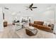 Spacious living room connects dining area and kitchen, complete with sleek wood floors at 132 Rosa Bella Vw, Debary, FL 32713