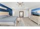 Expansive main bedroom boasts elegant decor, a tray ceiling, and plenty of natural light at 132 Rosa Bella Vw, Debary, FL 32713