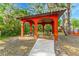 Community picnic pavilion with tables offers a shady place to relax and enjoy the Florida weather at 132 Rosa Bella Vw, Debary, FL 32713