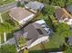 Aerial view of a home showing the in-ground pool and screened in porch at 13214 Triphammer Way, Orlando, FL 32828