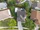 Aerial view of home featuring a backyard pool, screened patio, and solar panels at 13214 Triphammer Way, Orlando, FL 32828