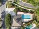 Overhead view of community swimming pool with lounge seating at 13214 Triphammer Way, Orlando, FL 32828