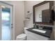 Charming bathroom offers a modern sink and access to outside at 13214 Triphammer Way, Orlando, FL 32828