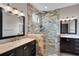 Bathroom features a glass shower enclosure and dual vanities at 13214 Triphammer Way, Orlando, FL 32828