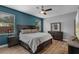 Comfortable bedroom boasts natural light, ceiling fan, ensuite bath and plenty of space at 13214 Triphammer Way, Orlando, FL 32828