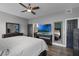 Open and airy bedroom features wood-look floors and ensuite bathroom at 13214 Triphammer Way, Orlando, FL 32828
