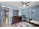 ' bedroom with ceiling fan, airplane decor, daybed, chair and dresser at 13214 Triphammer Way, Orlando, FL 32828