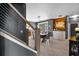 Elegant dining room with modern lighting and a built-in wine rack and storage at 13214 Triphammer Way, Orlando, FL 32828