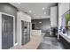 Spacious kitchen area with stainless steel appliances, island, and geometric backsplash at 13214 Triphammer Way, Orlando, FL 32828
