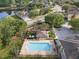 Aerial view of the community pool, playground, and surrounding neighborhood at 13214 Triphammer Way, Orlando, FL 32828
