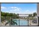 Relaxing balcony view overlooking the pool and the serene water at 13415 Blue Heron Beach Dr # 208, Orlando, FL 32821