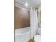 Inviting bathroom with a soaking tub and tiled walls, offering a spa-like experience at home at 13415 Blue Heron Beach Dr # 208, Orlando, FL 32821
