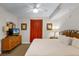 Bedroom features television, dresser and comfortable king bed at 13415 Blue Heron Beach Dr # 208, Orlando, FL 32821
