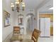 Dining area featuring chandelier, glass table and decorative mirror at 13415 Blue Heron Beach Dr # 208, Orlando, FL 32821