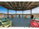 Picturesque gazebo with colorful chairs overlooking the serene waterfront at 13415 Blue Heron Beach Dr # 208, Orlando, FL 32821