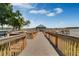 Inviting waterfront pier leading to a charming gazebo overlooking the lake at 13415 Blue Heron Beach Dr # 208, Orlando, FL 32821
