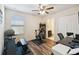 Bedroom space with hardwood floors, neutral paint, and a ceiling fan at 14090 Avenue Of The Groves, Winter Garden, FL 34787