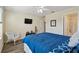 Bright bedroom featuring a ceiling fan, ensuite bathroom, and light-colored walls at 14090 Avenue Of The Groves, Winter Garden, FL 34787