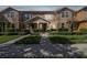 A cozy multi-Gathering home with manicured lawns and welcoming curb appeal in a Gathering-friendly community at 14090 Avenue Of The Groves, Winter Garden, FL 34787