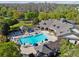 Community pool featuring lounge chairs, shaded seating areas, and a spacious pool deck at 14090 Avenue Of The Groves, Winter Garden, FL 34787