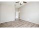 This bedroom features a ceiling fan, wood floors, and a doorway leading to other rooms at 1413 Timberbend Cir, Orlando, FL 32824