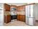 Modern kitchen featuring stainless steel appliances and dark wood cabinets at 1413 Timberbend Cir, Orlando, FL 32824
