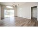 Spacious living room featuring wood-look flooring and large sliding glass doors at 1413 Timberbend Cir, Orlando, FL 32824