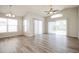 Bright living room with hardwood floors, vaulted ceiling, and large sliding glass doors at 1413 Timberbend Cir, Orlando, FL 32824