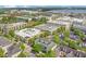 Overhead shot showcasing the townhome's prime location near commercial buildings and a serene lake at 1425 Chatfield Pl, Orlando, FL 32814
