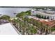 Beautiful aerial view showcasing buildings with a red tile roof near the water with palm tree-lined streets at 1425 Chatfield Pl, Orlando, FL 32814
