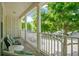 This balcony has room for seating, nice railings, and a view of the beautiful tree-lined street at 1425 Chatfield Pl, Orlando, FL 32814
